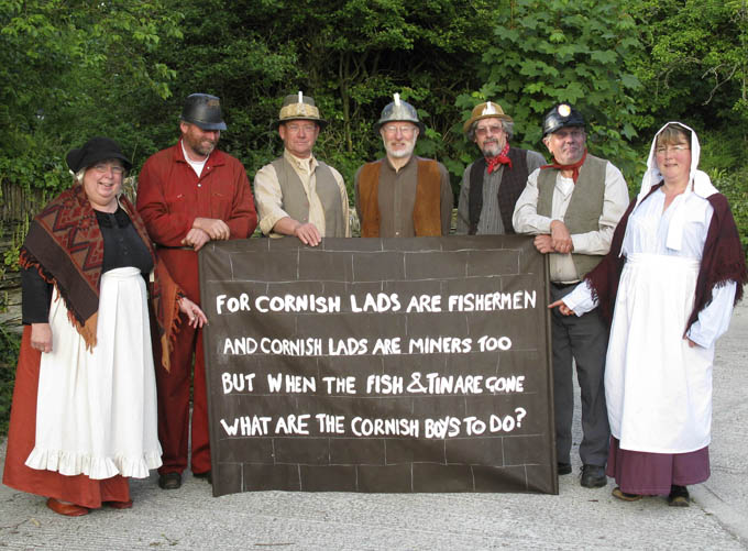 PIcture of the cast with their portable mine wall